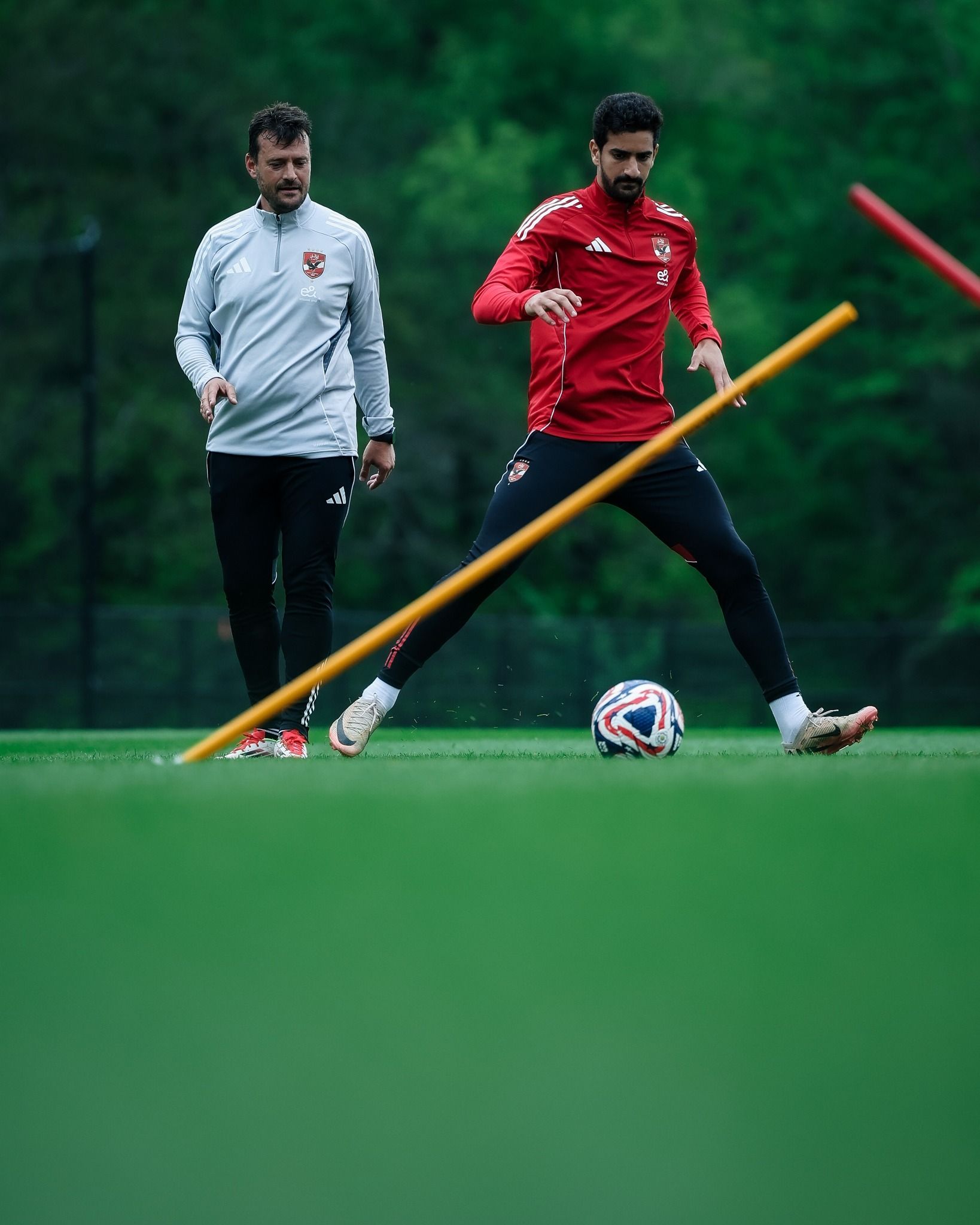 May be an image of 2 people, people playing soccer, people playing football and text