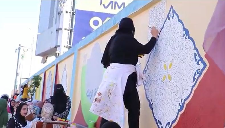 المشاركة في رسم الجداريات